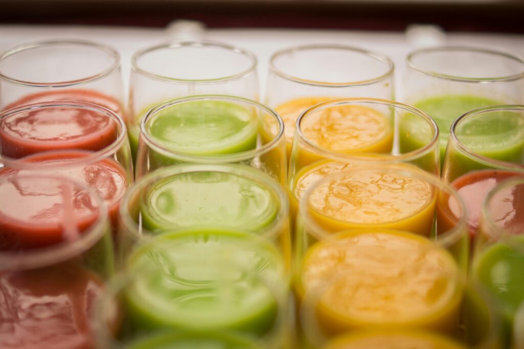 Vibrant selection of assorted fruit juices in glasses, showcasing variety and freshness.